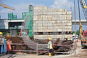 Construction workers stacking the maintain load test block at the construction site